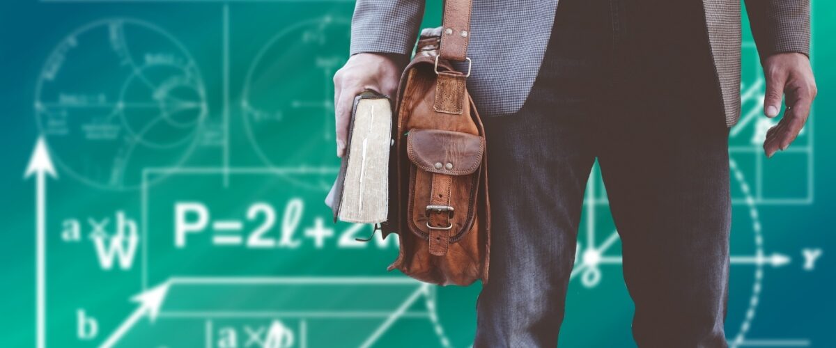 student holding book